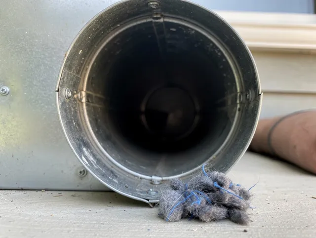 Garfield Heights Dryer Vent Cleaning technician using specialized equipment to clear severe dryer vent blockage in Garfield Heights